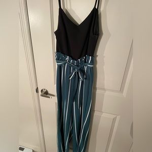 Black top with green striped bottoms jumpsuit